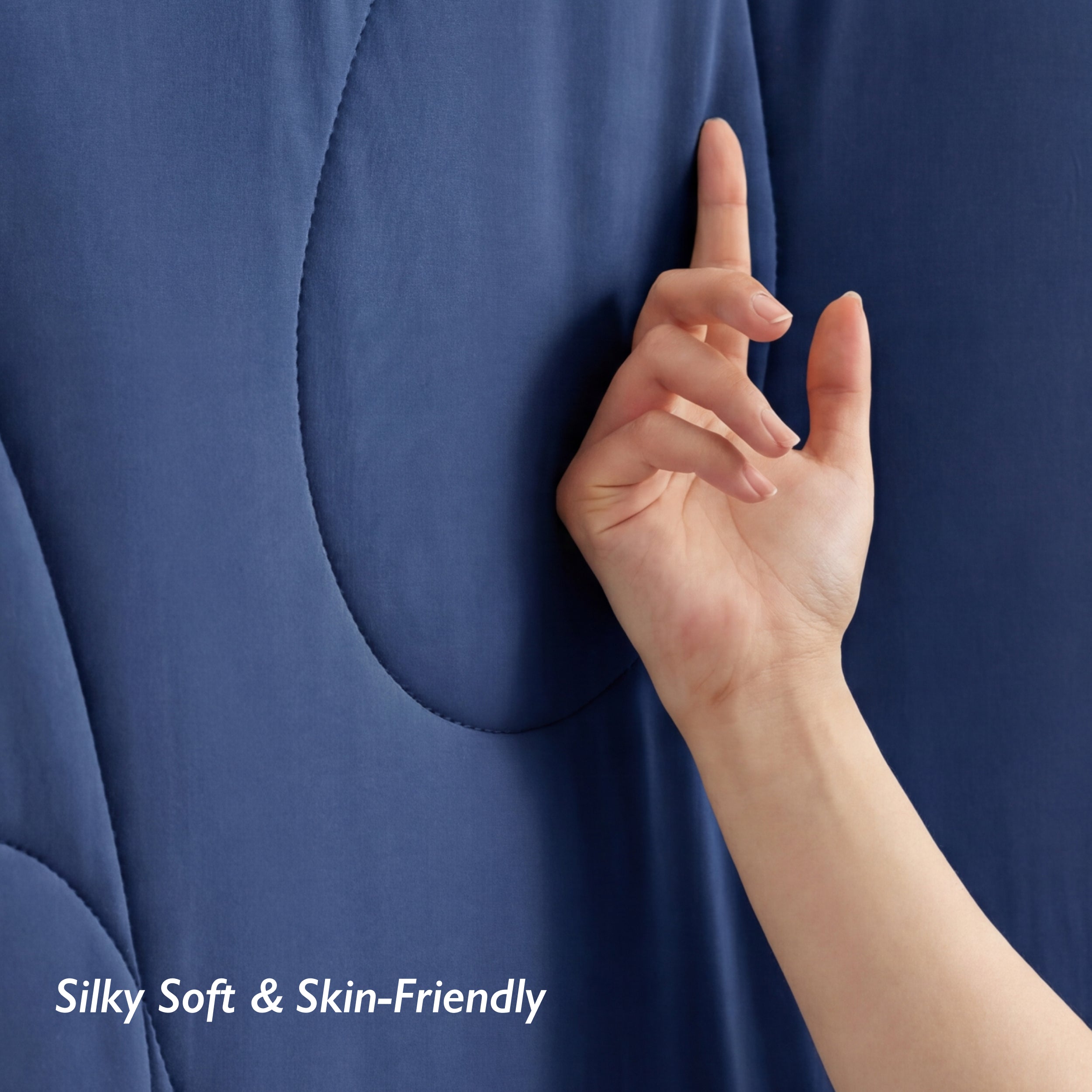 Breescape twilight blue cooling comforter blanket: hand touches silky soft, skin-friendly BlendTek™ fabric.