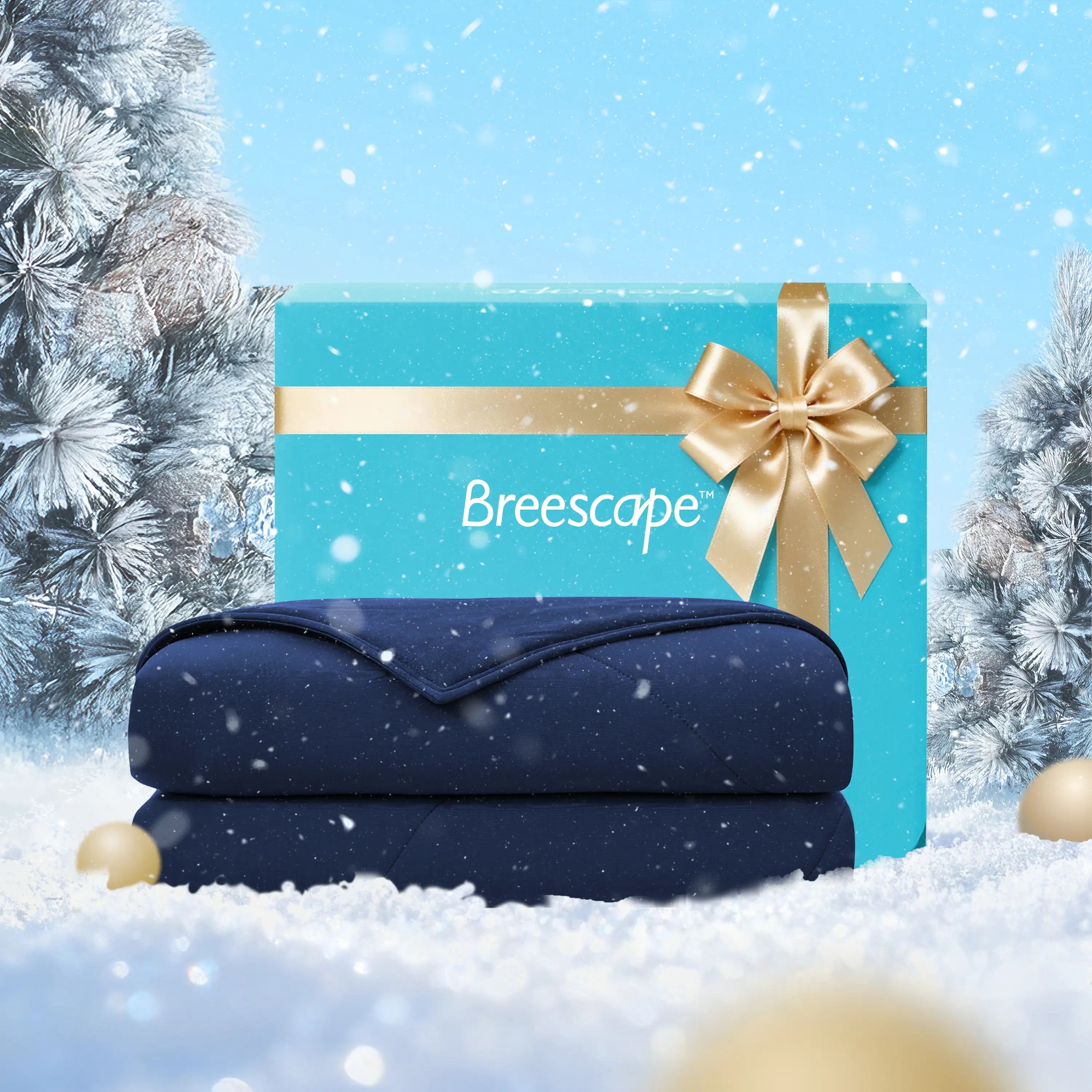 Navy blanket with a gold bow in front of a blue gift box labeled 'Breescape' against a snowy background.