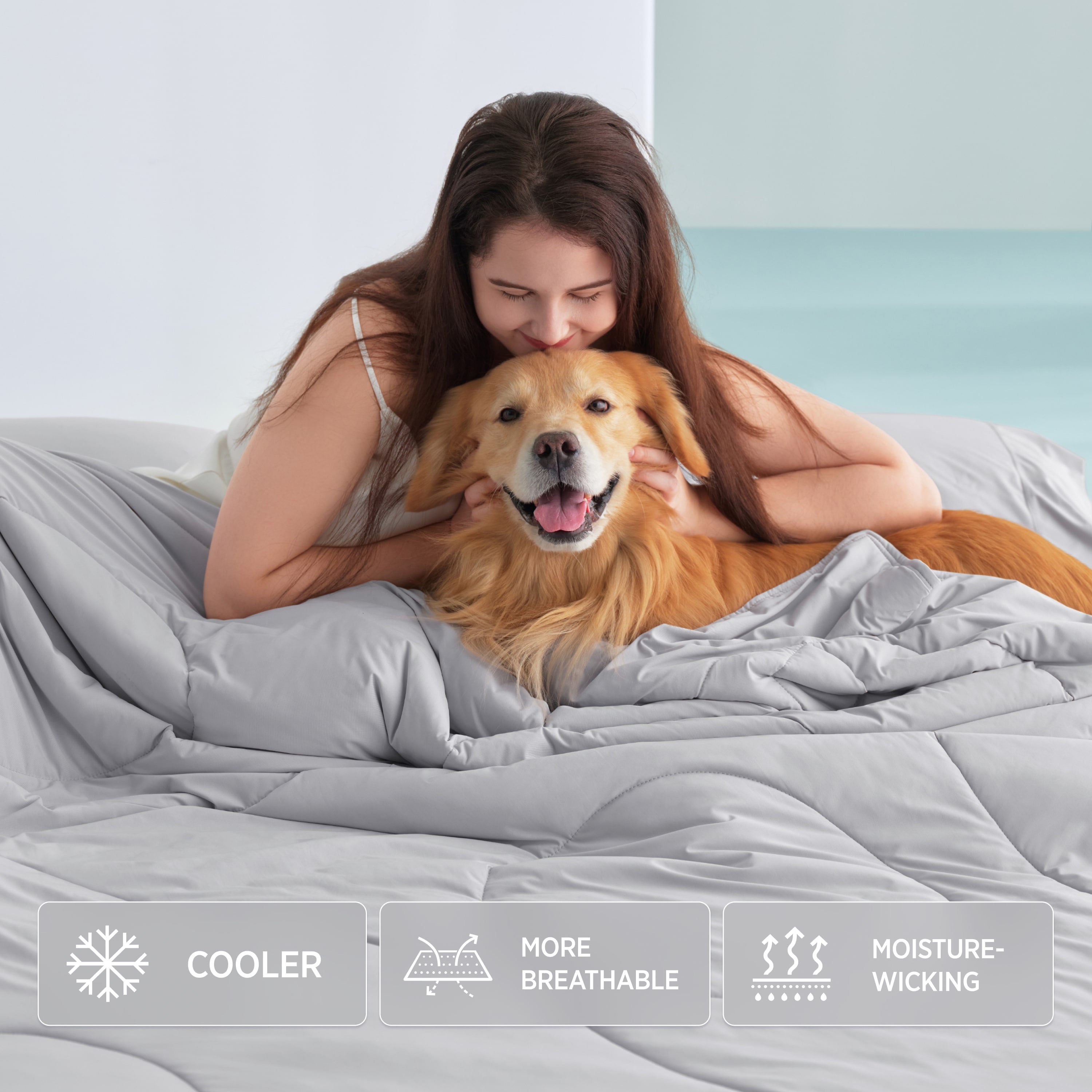 Breescape misty grey cooling comforter with woman and dog, showing cooler, breathable, moisture-wicking features.