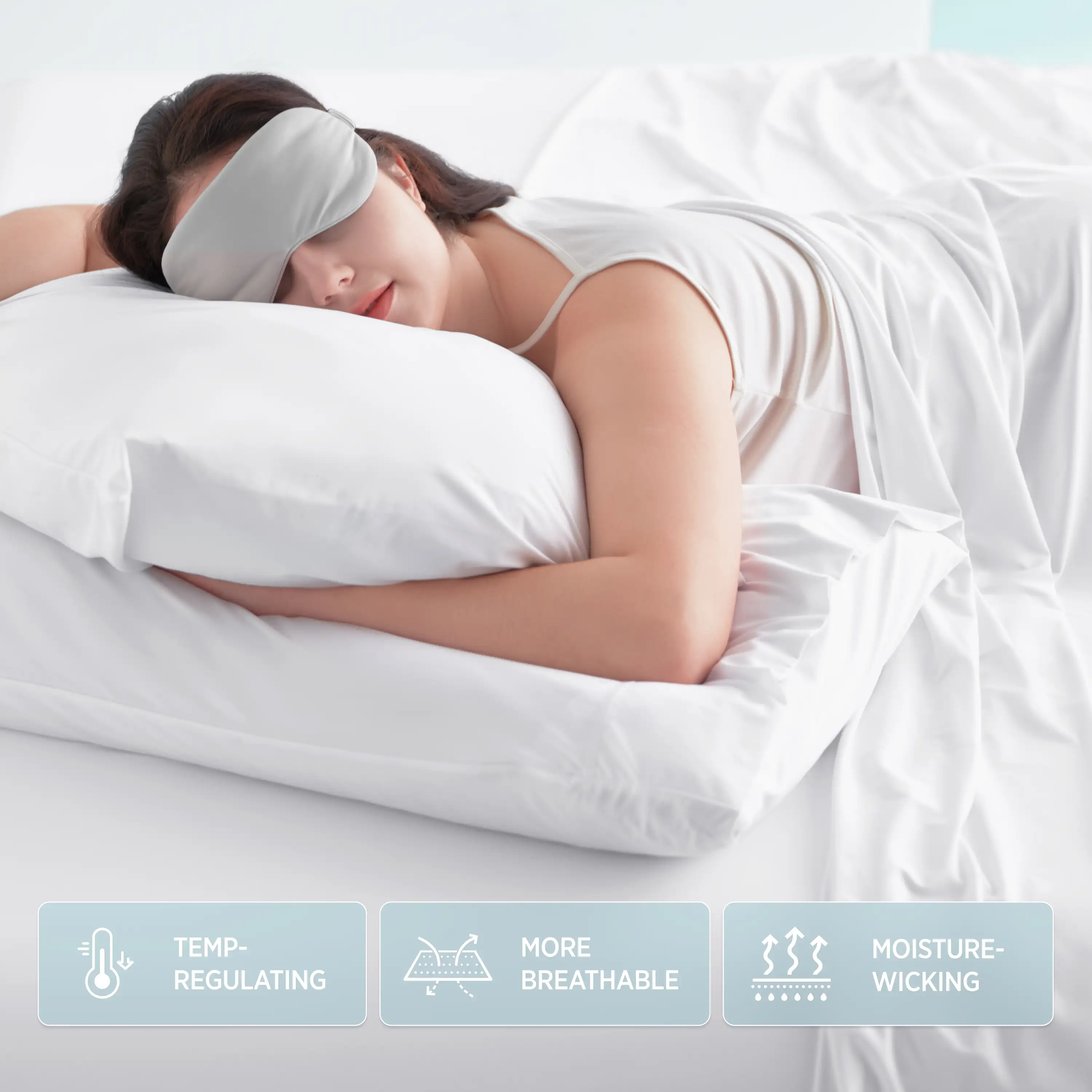Woman sleeping with a gray sleep mask on, surrounded by white bedding. #color_snow-white