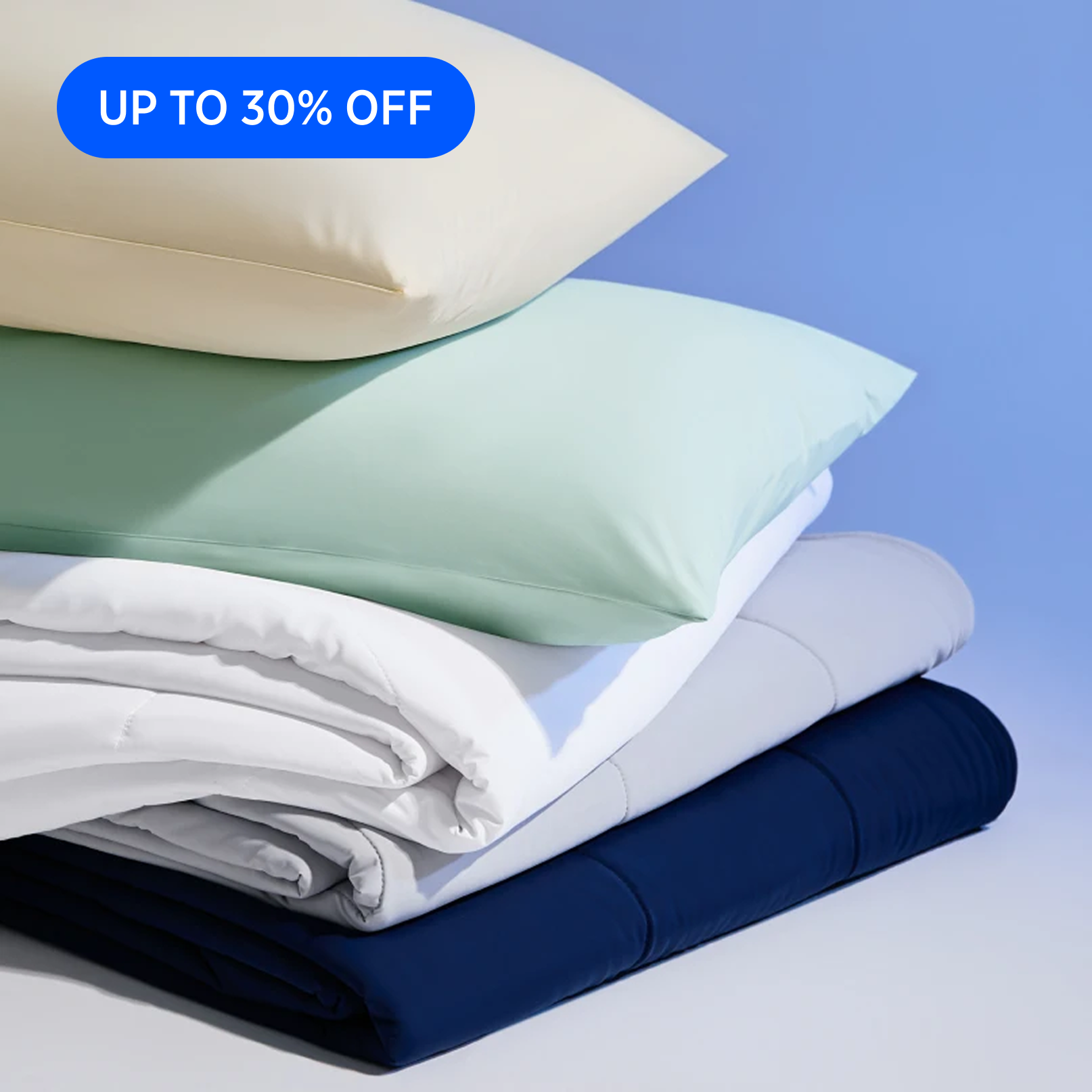 Stack of folded bedding with pillows on a blue background and 'Up to 30% Off' text.