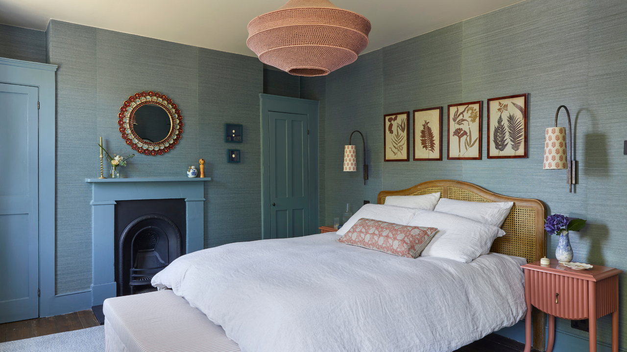 Cozy bedroom with a bed, fireplace, and decorative elements.