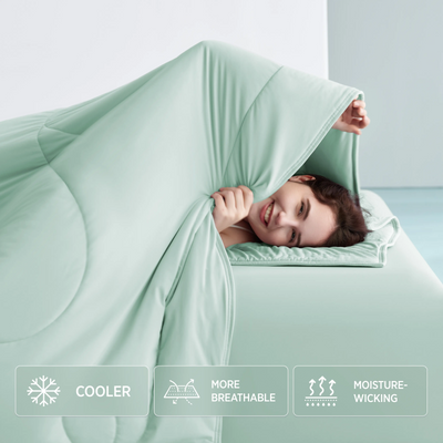 Cooling comforter bundle in mint green, highlighting cooler, breathable, moisture-wicking properties for hot sleepers.