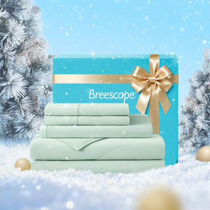 Breescape bedding set with a gold bow in a snowy scene