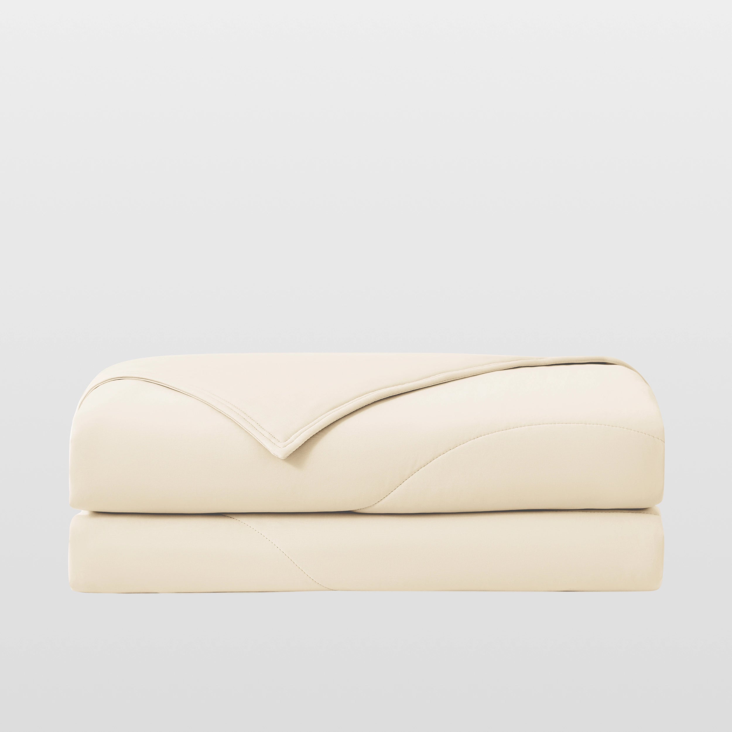 Breescape ivory cooling comforter for night sweats, breathable & folded.