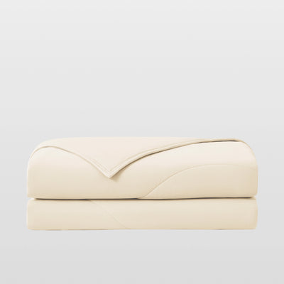 Breescape ivory cooling comforter for night sweats, breathable & folded.