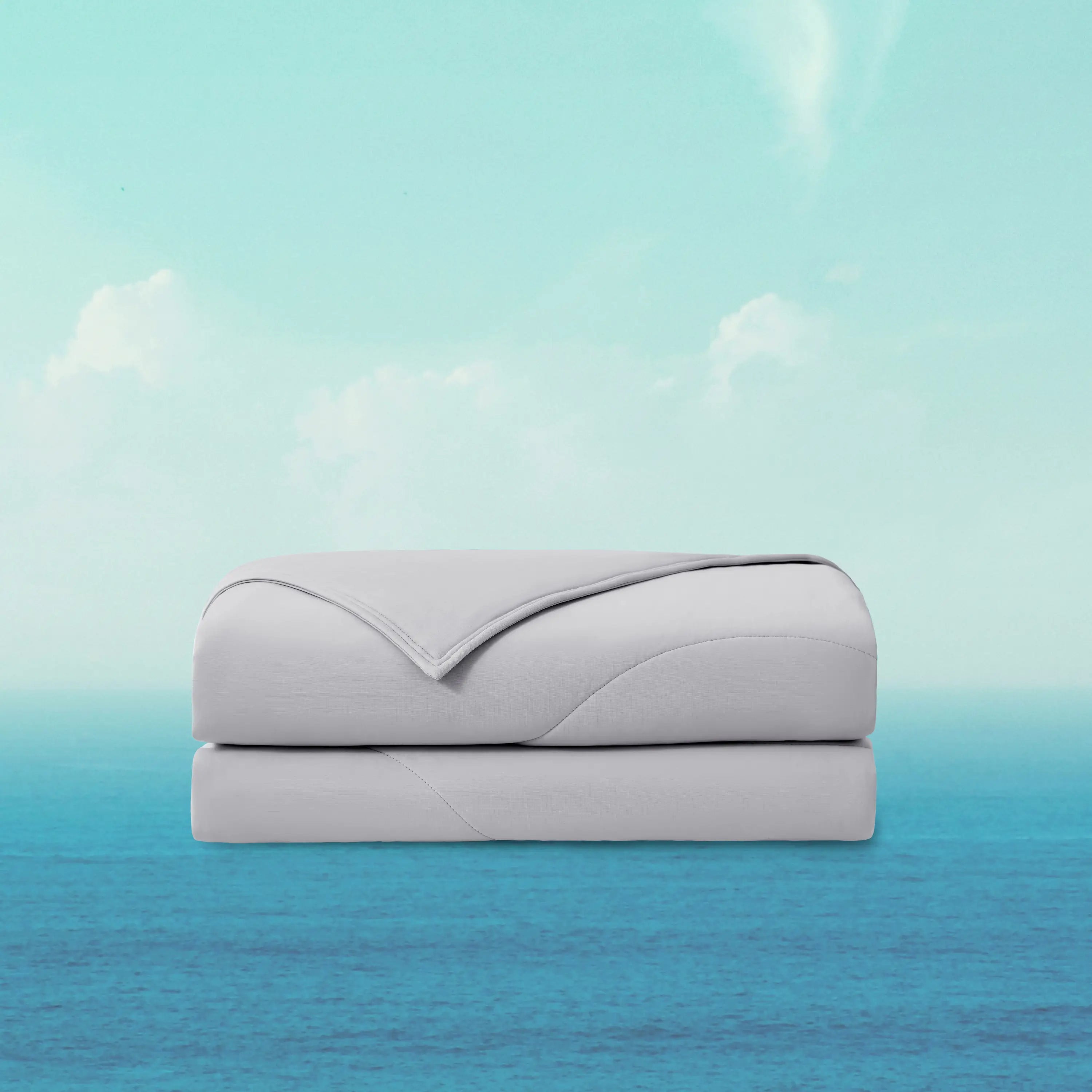 Folded gray blanket on a gradient background