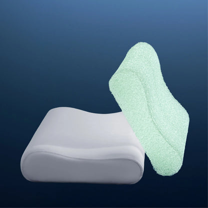 White pillow and green sponge on a dark blue background #color_misty-grey