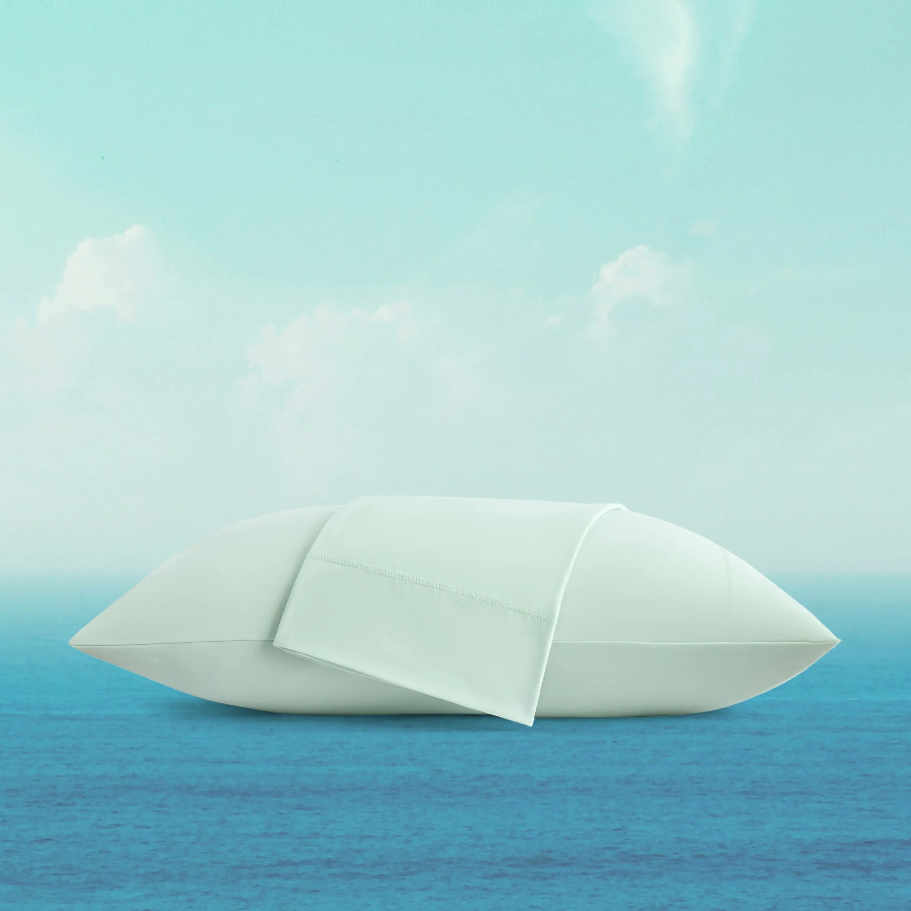 White paper boat on a blue water surface with a light blue sky.
