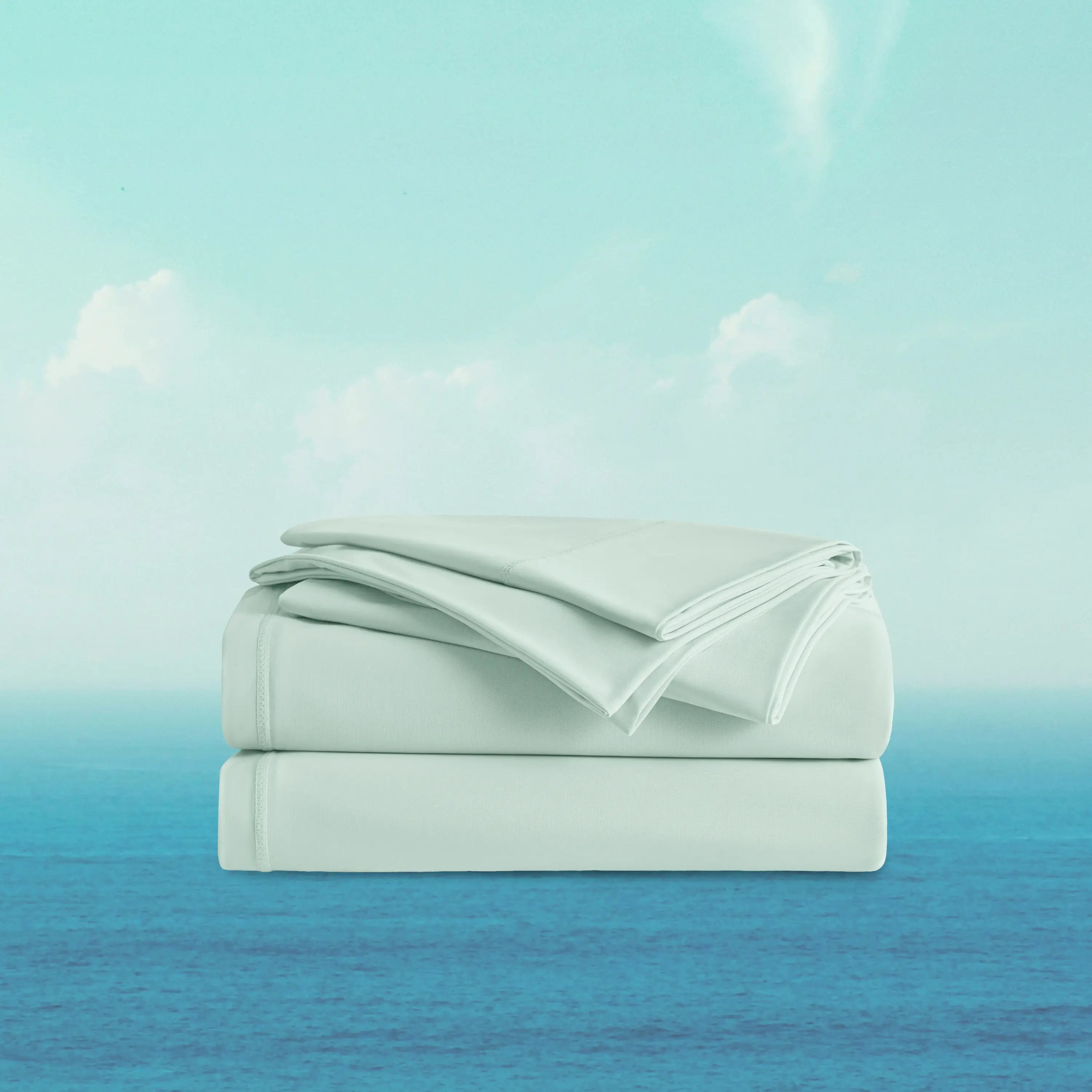 Folded light blue bed sheets on a gradient background