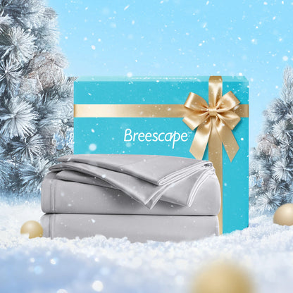 Gray bedding set with a blue Breescape box against a snowy background