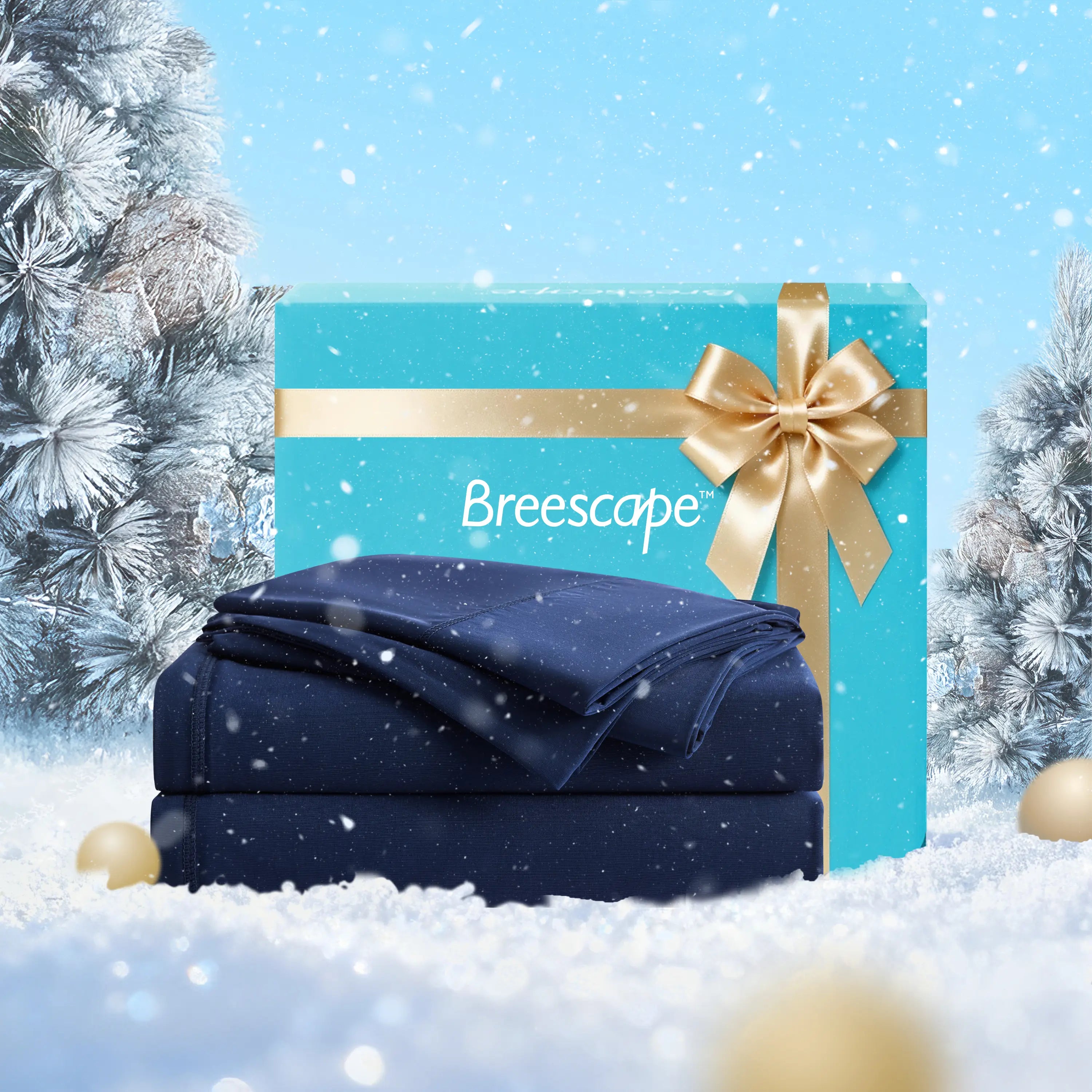 Navy blue blanket with a gold bow and 'Breescape' branding in front of a turquoise gift box with a gold ribbon, set against a snowy background.