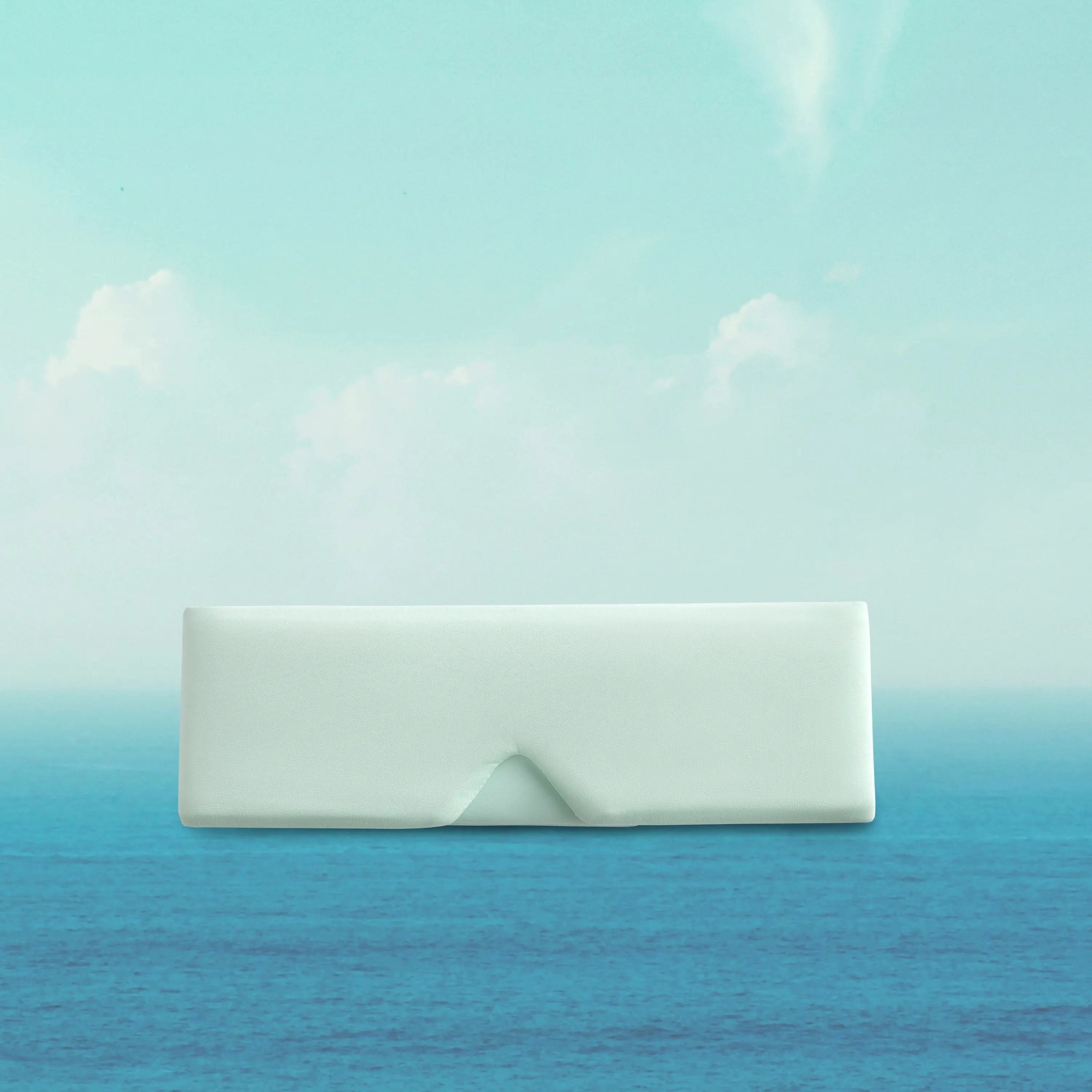 White rectangular object on a gradient blue and green background