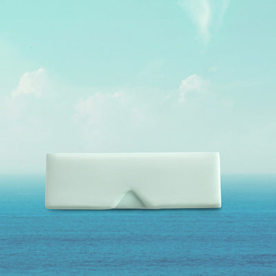 White rectangular object on a gradient blue and green background