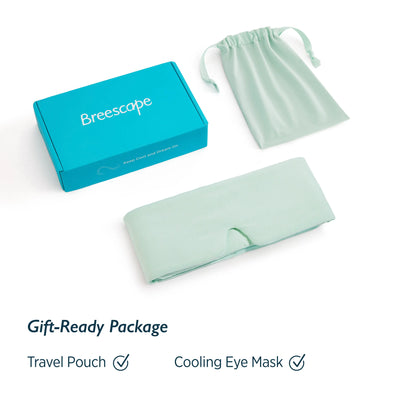 Breescape cooling eye mask in mint green with travel pouch and gift box, featuring dual-sided cooling fabric.