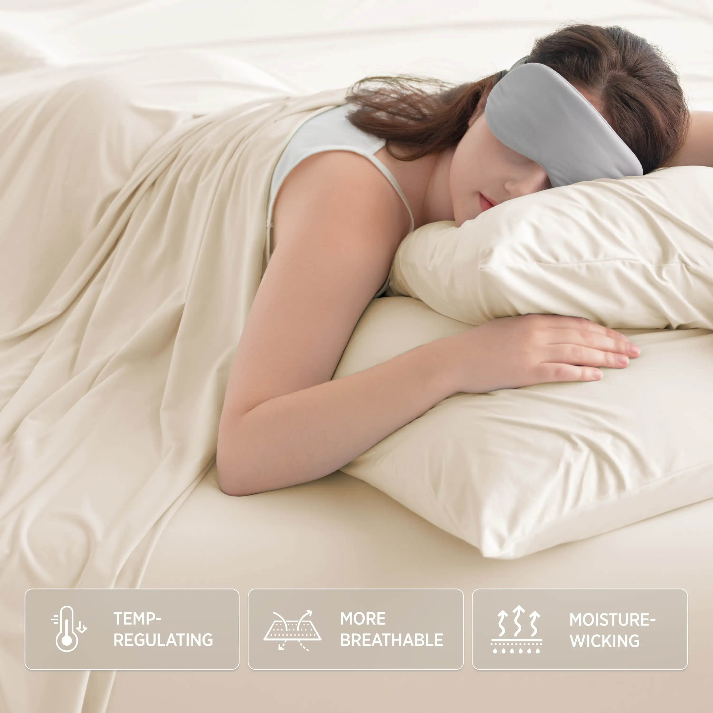 Woman sleeping with a gray sleep mask on, covered with a beige blanket. #color_ivory