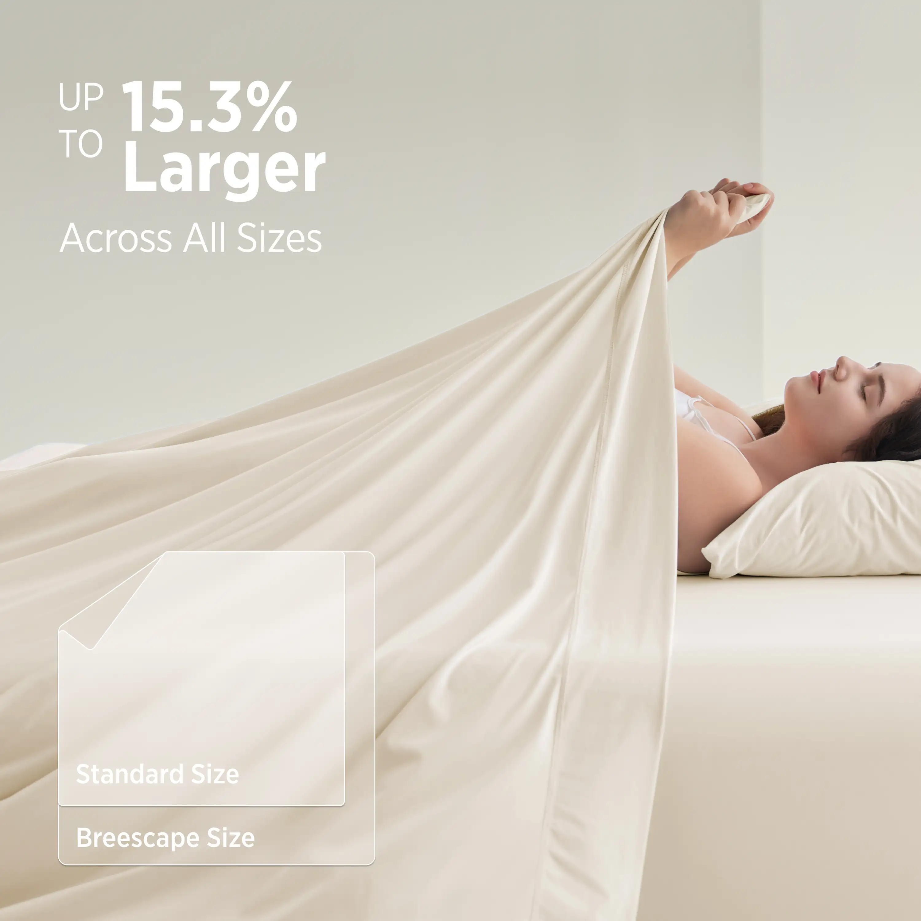 Woman lying on a bed with a large beige blanket, promotional text about size increase. #color_ivory