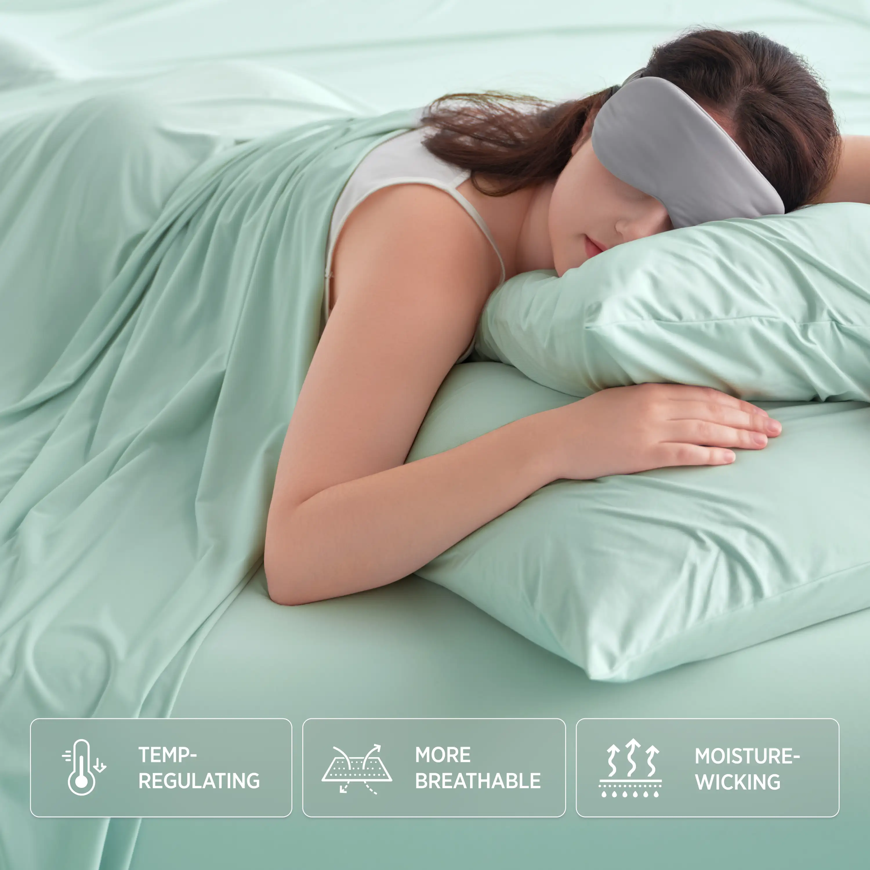 Woman sleeping with a green pillow and blanket, wearing a sleep mask, on a light green bed.  #color_mint-green
