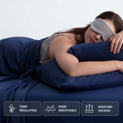 Woman lying in bed with a sleep mask on, wearing a nightgown, with text labels about product features. #color_twilight-blue