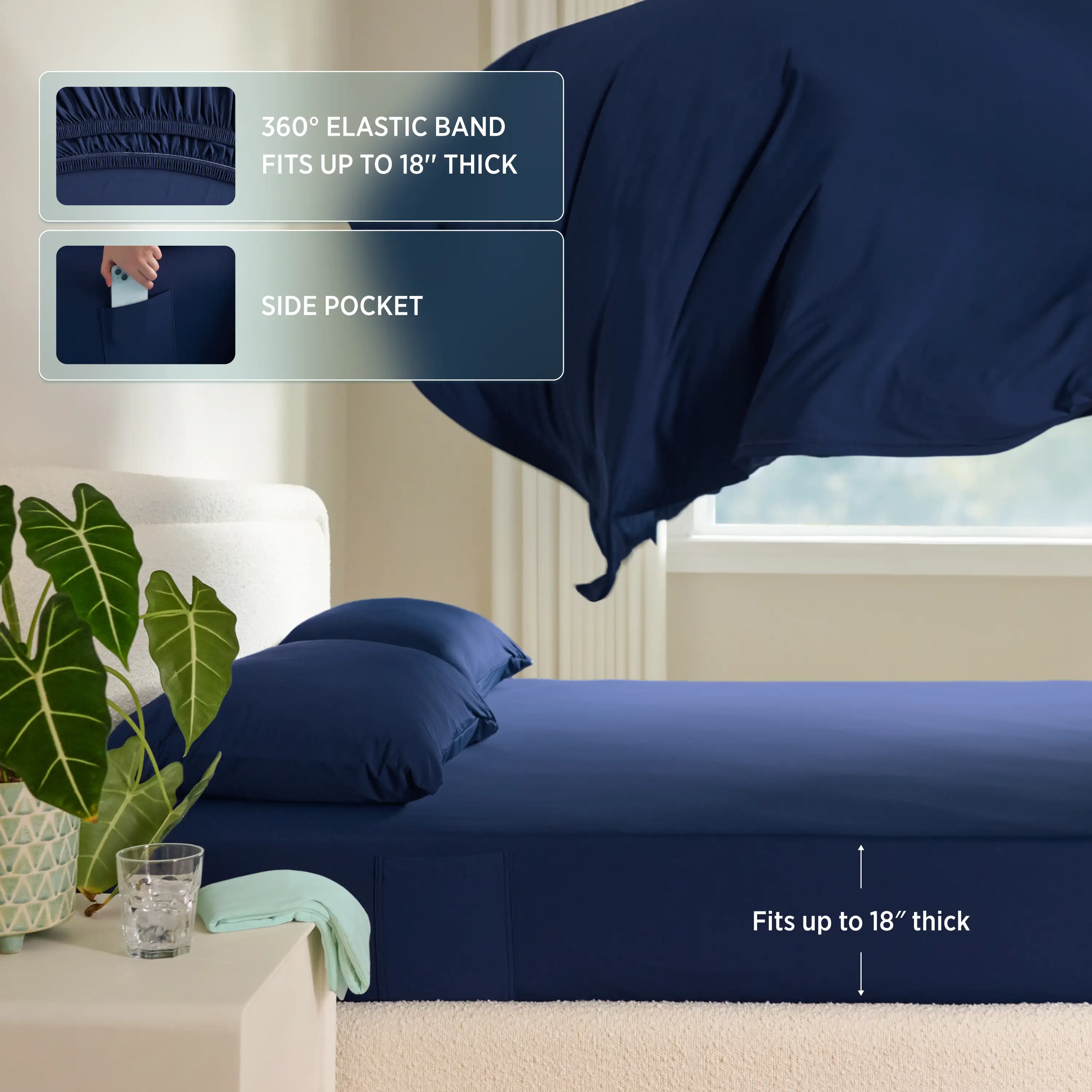 Navy blue fitted sheet with elastic band and side pocket on a bed in a room. #color_twilight-blue