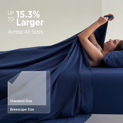 Woman lying under a large blue blanket with text about size comparison. #color_twilight-blue